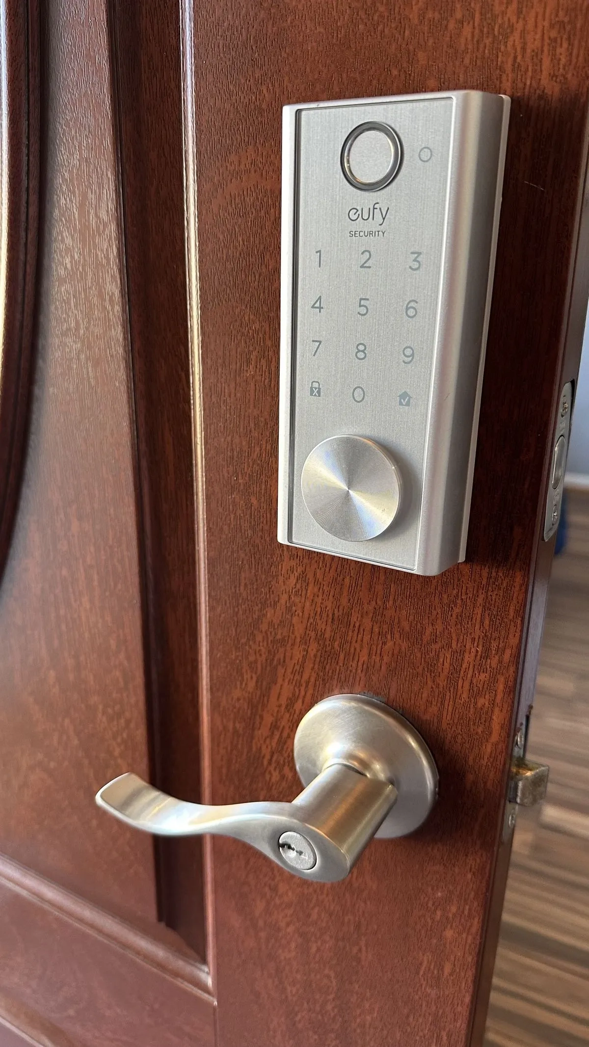 Commercial locksmith servicing an office storefront lock in Tuscaloosa, AL